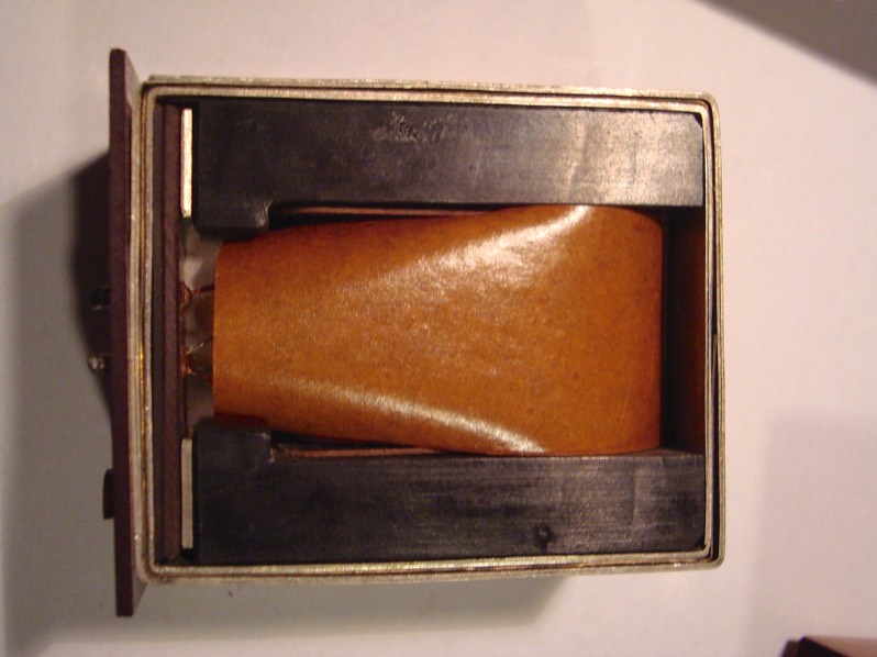 other side up, showing protective oil paper sheet